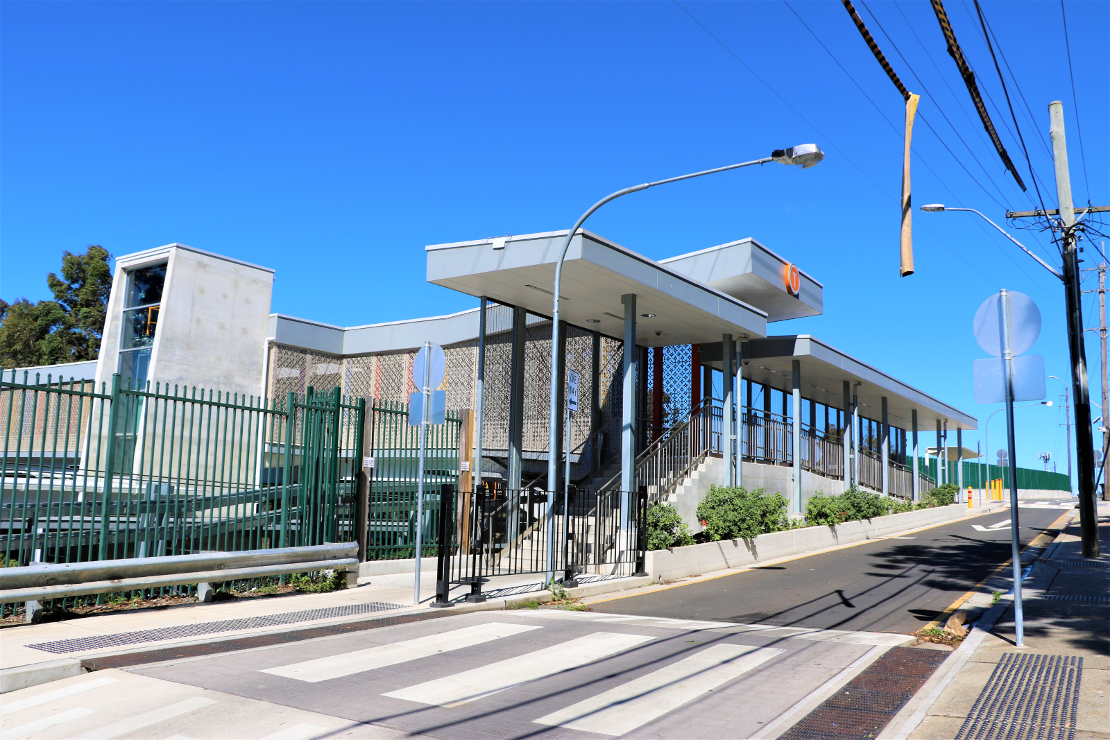 Accessible ramp and canopy along the station approach