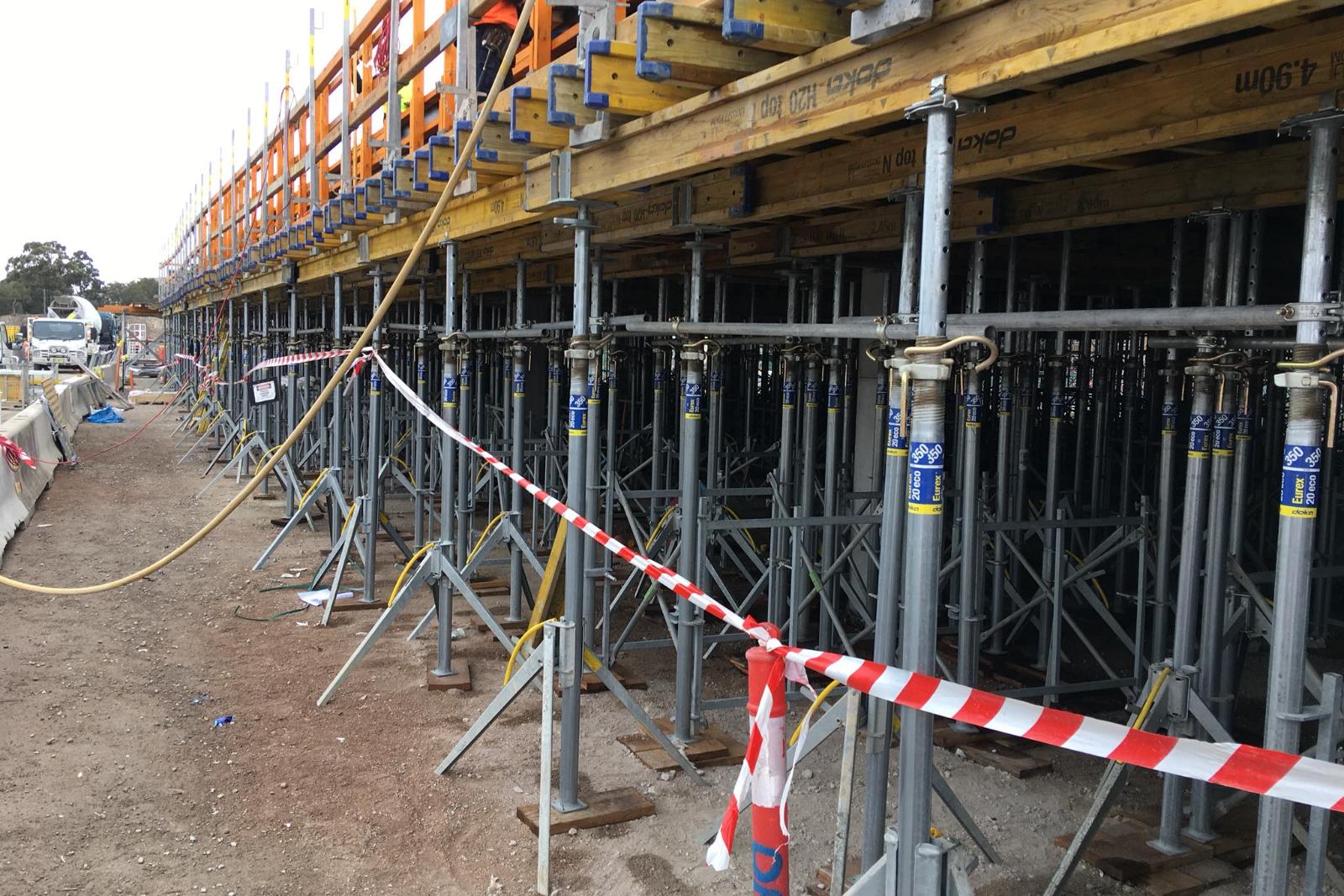 System formwork soffit on adjustable props with crew above